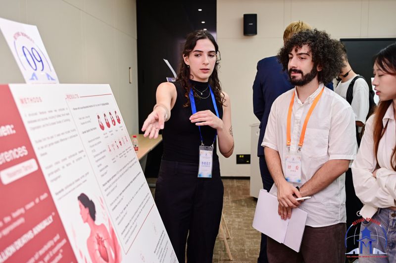 Listening to a student present her poster